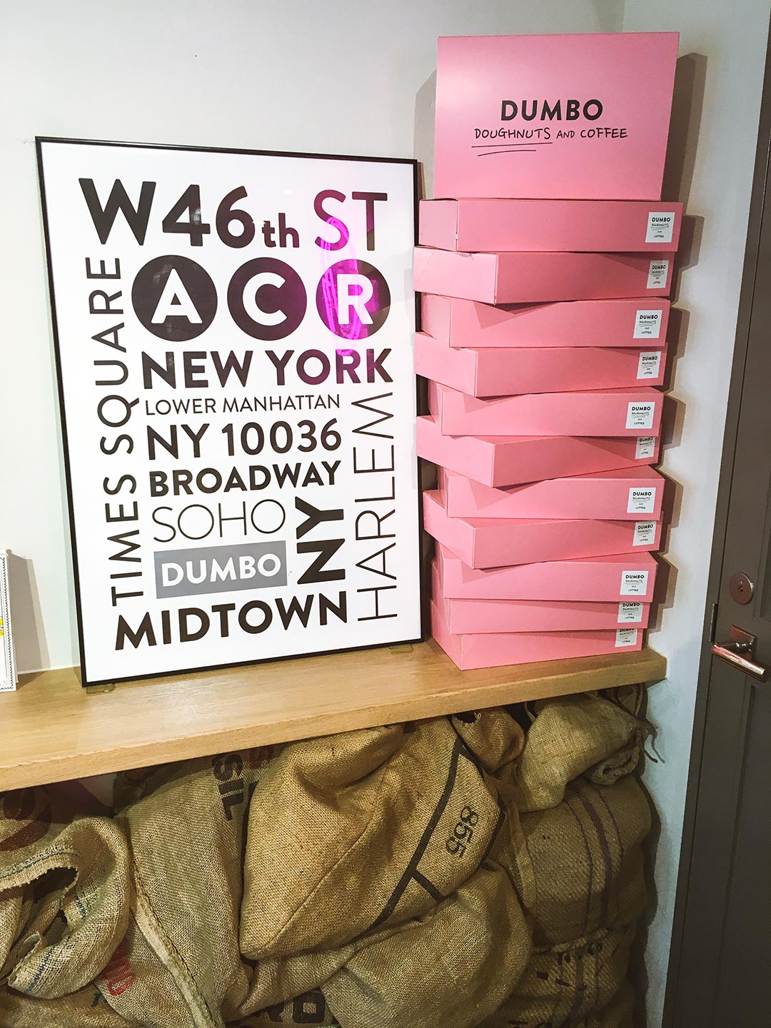 New York City posters and pink boxes at Dumbo Doughnuts in Azabujuban