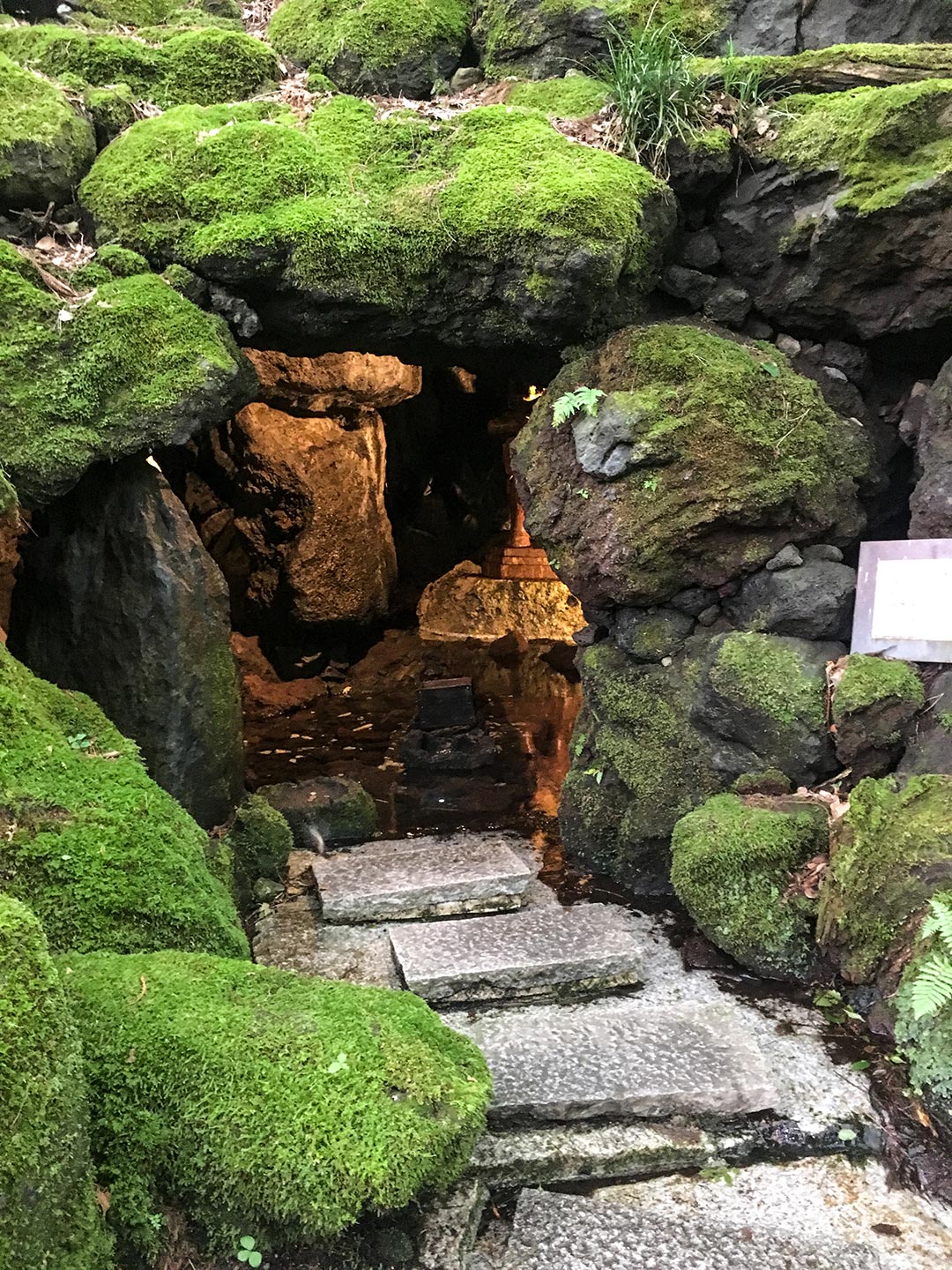 The outside view of a grotto housing buddhist statues at the Itchiku Kubota kimono Museum